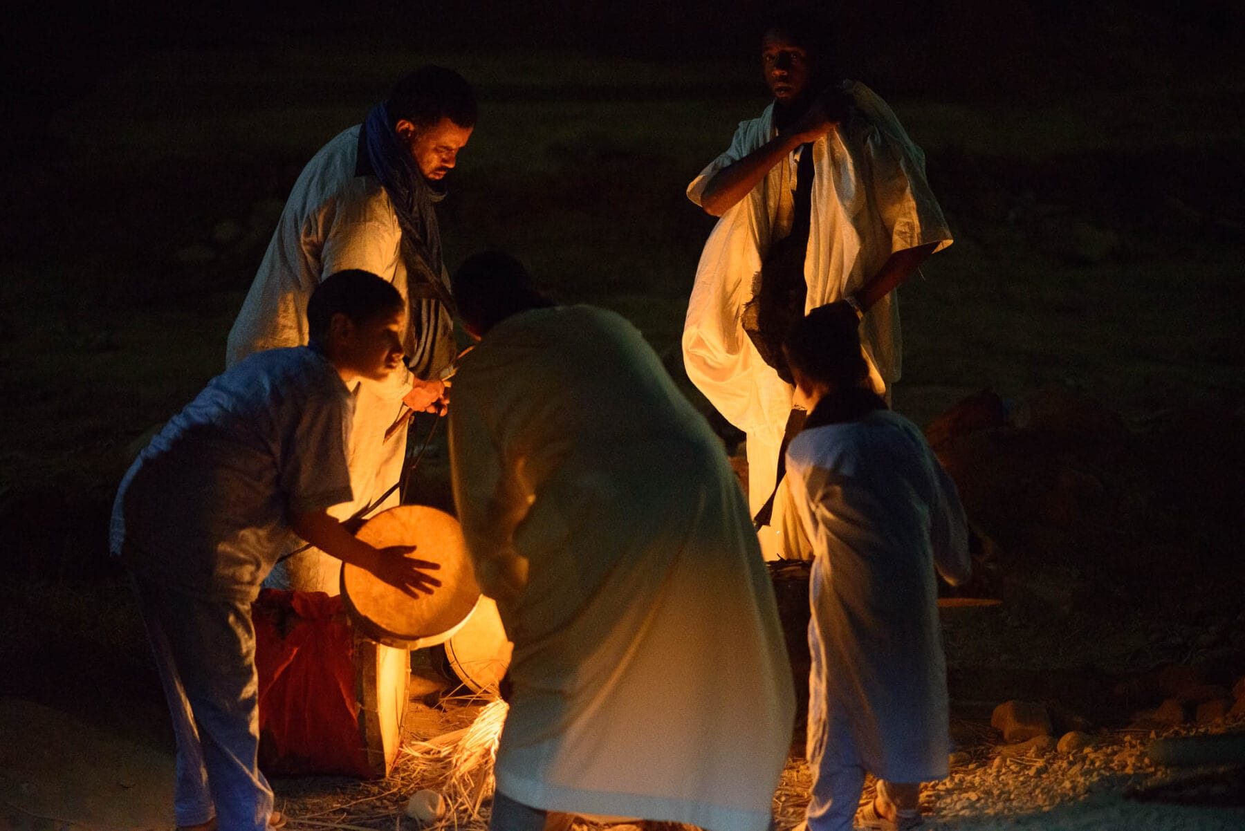 People gathered around a fire.